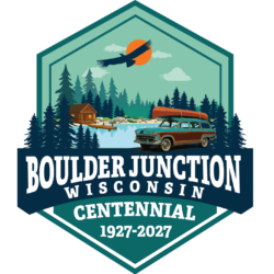 Logo with image of a station wagon carrying a canoe parked in front of a lake with a dock and a small wood cabin